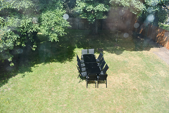 Back garden with seating area for up to 12 people